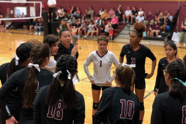 bcs varsity volleyball players get directions from coach humenansky